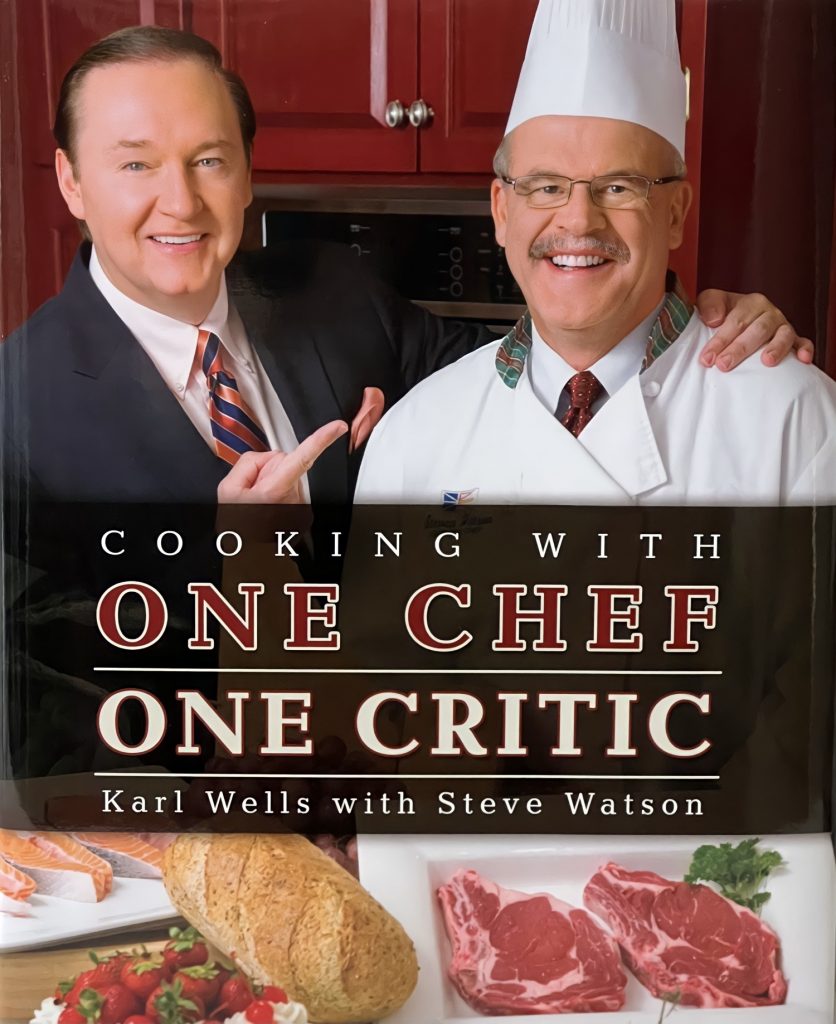Cover of the cookbook "Cooking with One Chef One Critic": Karl Wells and Steve Watson.